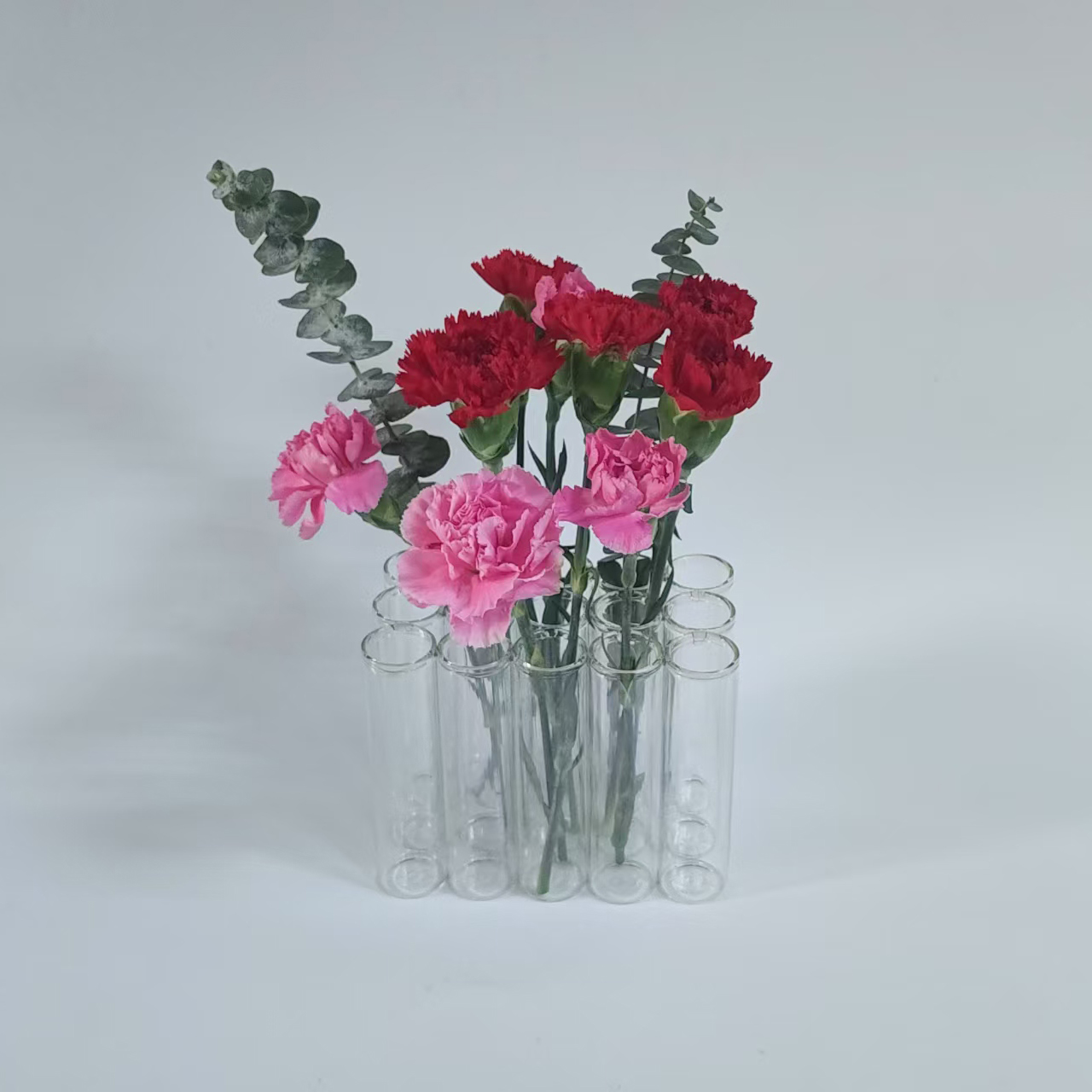 A set of 15 connected tube vases